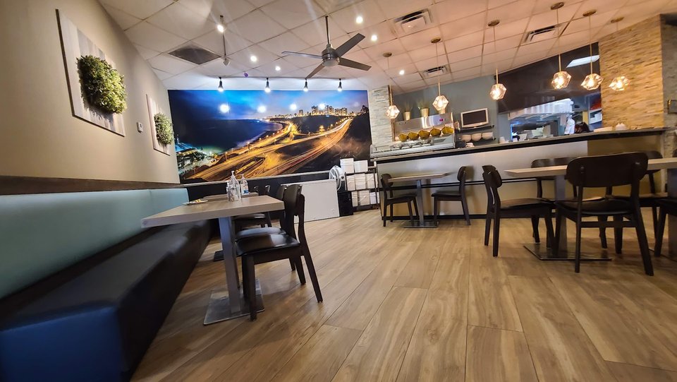 Peruvian seafood plates in an informal dining room.